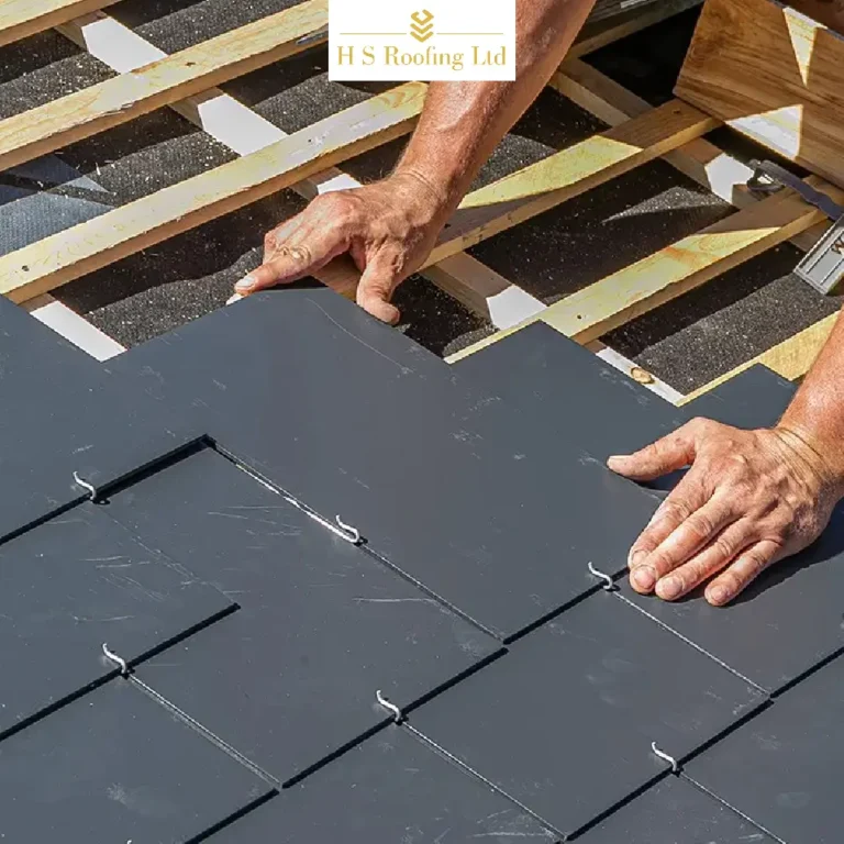 Roofers in Wandsworth repairing damaged roof tiles on a residential property
